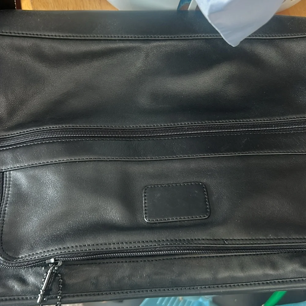 Tumi black leather bag